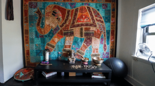 meditation room with elephant tapestry featured