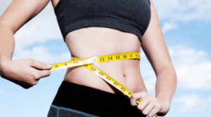 fast weight loss woman with measuring tape around waist featured