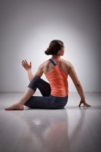 half spinal twist basic yoga pose for beginners