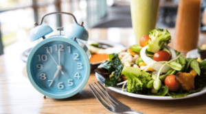 clock next to healthy salad featured