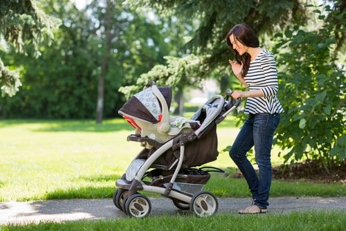 woman walking with stroller