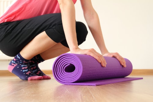 woman with yoga mat