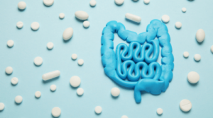 probiotic pills and blue gut model featured