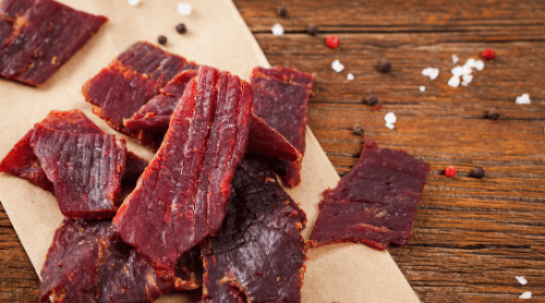 jerky on a butcher block featured