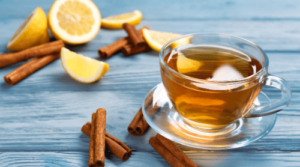 cinnamon tea with cinnamon sticks and lemon slices featured