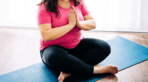 plus size woman on yoga mat featured