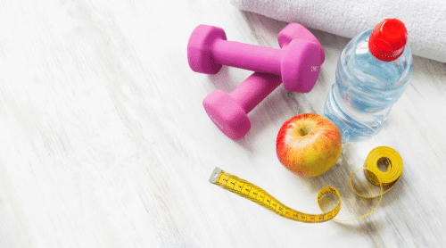 dumbbells, water bottle, apple, towel and measuring tape featured