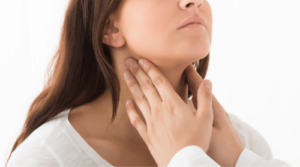 woman having thyroid checked by doctor featured