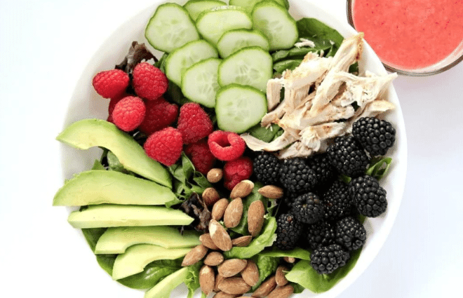 salad with berries, chicken, cucumbers, almonds and avocado