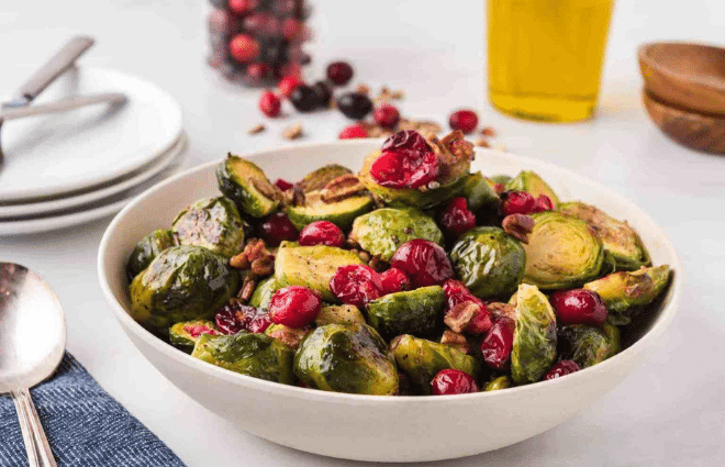 roasted brussels sprouts, cranberries and pecans in a bowl