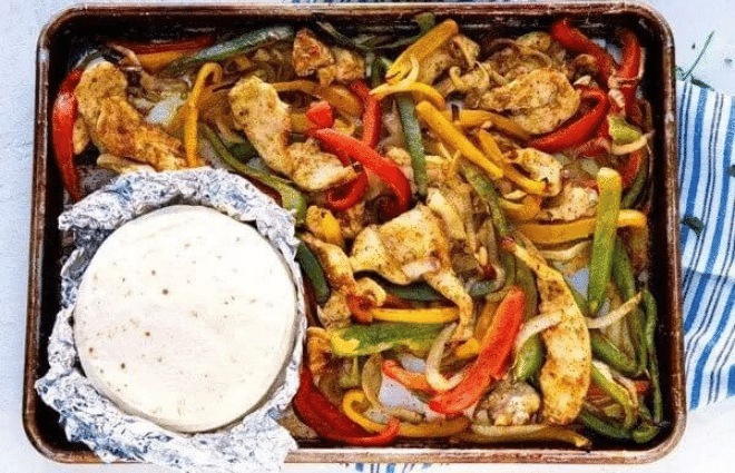 sheet pan chicken fajitas on sheet pan