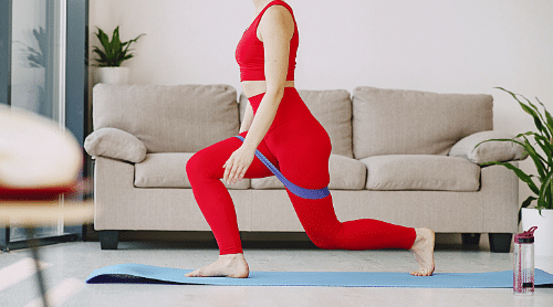 woman in red workout outfit exercising to reverse insulin resistance