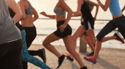 Runners on a beach