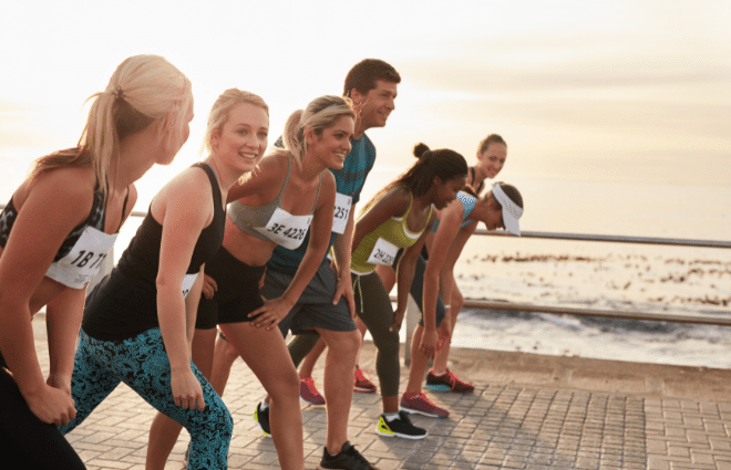 Runners at the starting line of a race on the beach