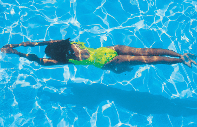 Woman swimming in a pool for exercise