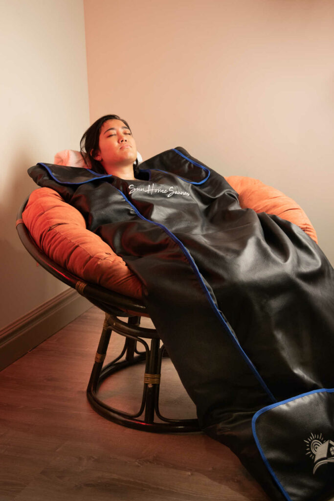 Infrared Sauna Blanket Review using blanket in chair