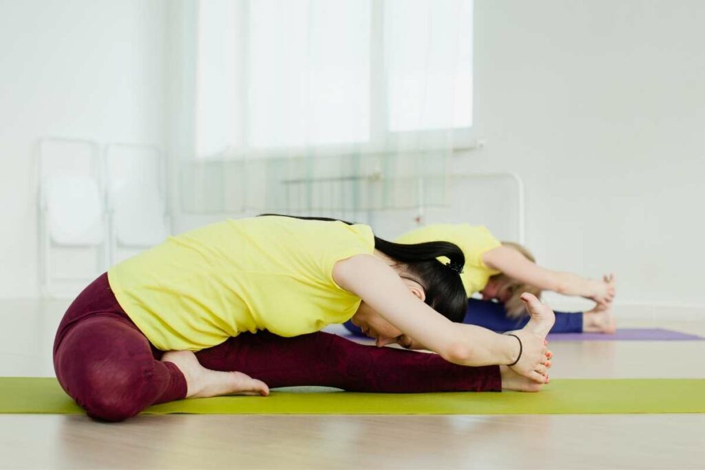 26 Bikram Yoga Poses - sitting head to knee stretch