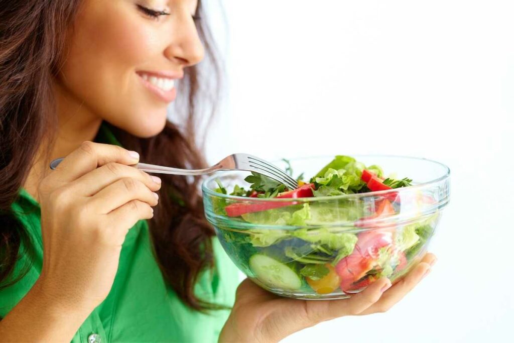 How to Lose Weight Quickly and Safely woman eating a salad