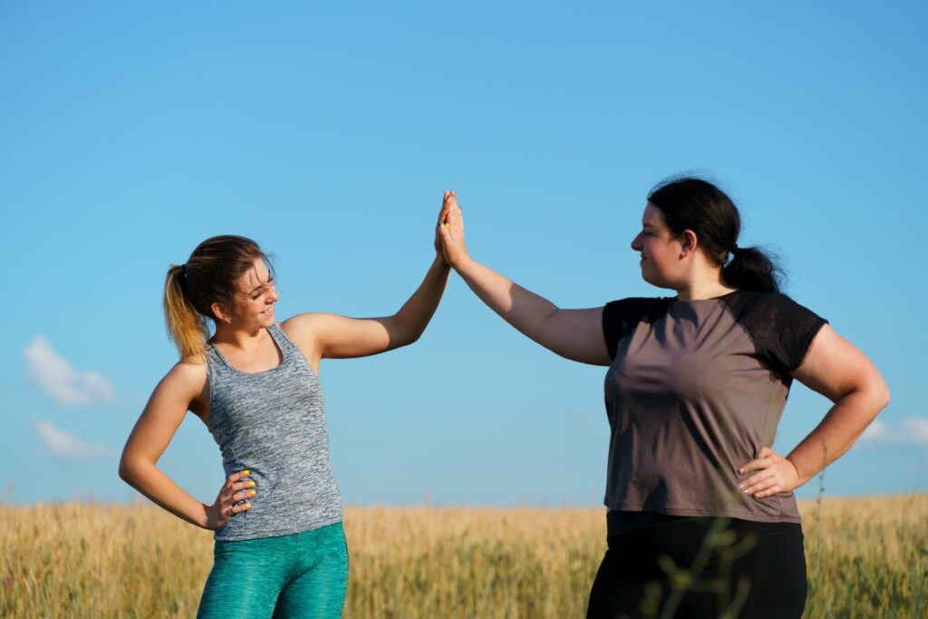 women love fast loss challenge high five outdoors