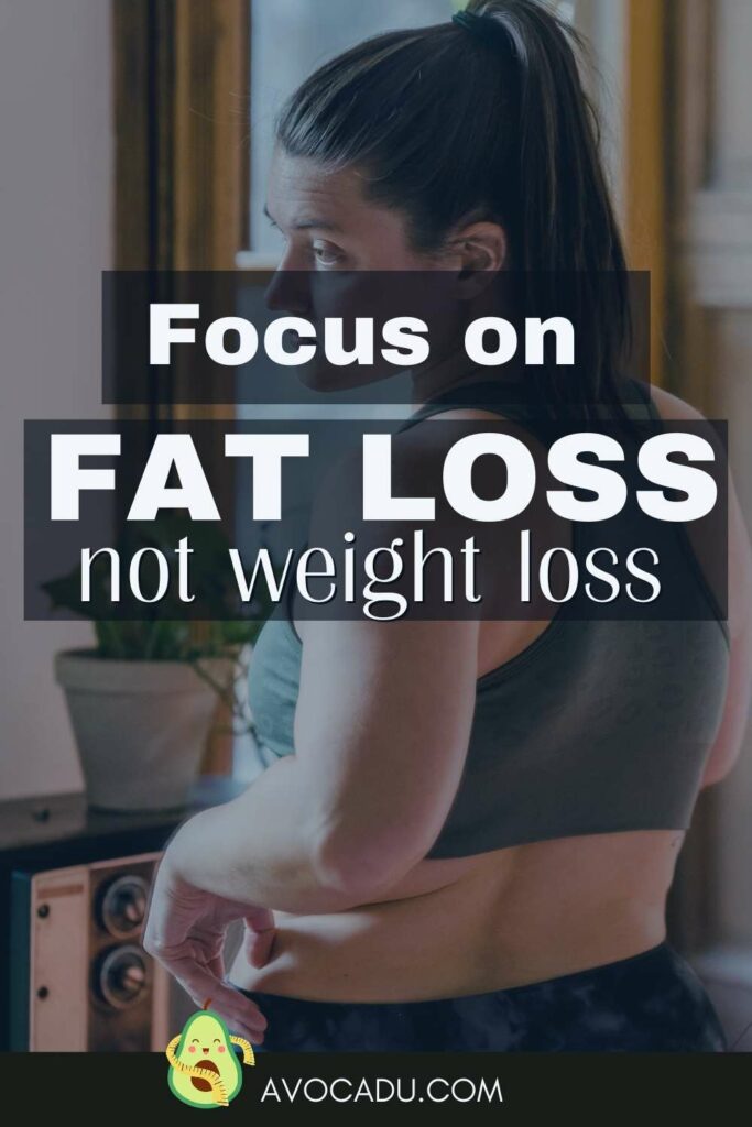 Focus On Fat Loss not weight loss woman looking at fat rolls
