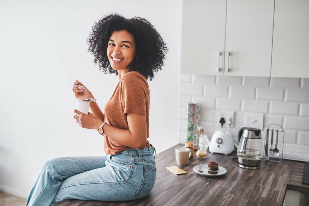 Probiotics for Mental Health happy woman eating yogurt